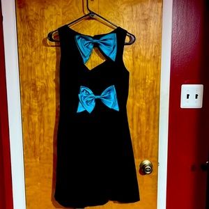 Cute crushed velvet dress with teal bows on the back and a sewn in petticoat